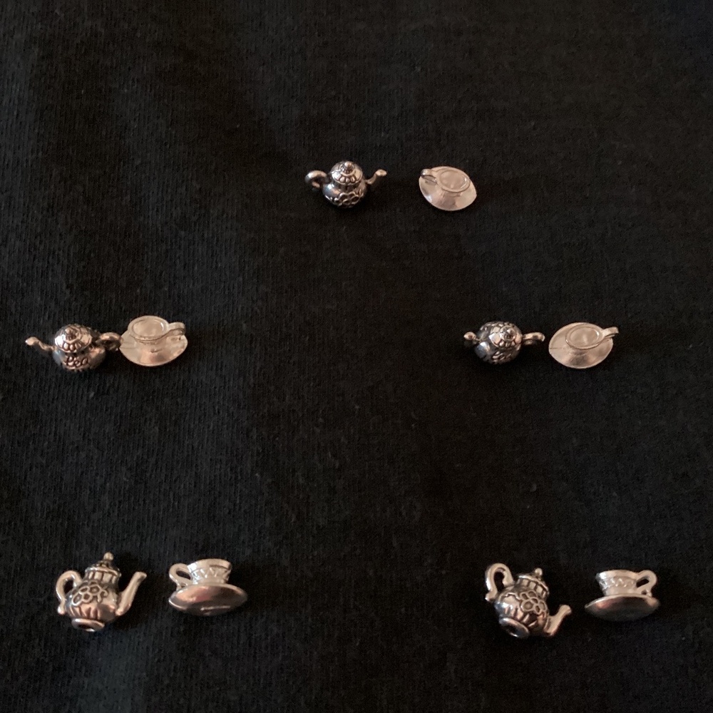 Miniature tea pot and cup saucer silver colored